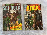 Front covers of two vintage Sgt Rock comic books, issue #205 and #228, showing WWII battle scenes and price display.