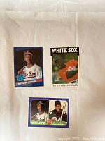 Front view of three baseball cards with Michael Jordan in White Sox uniforms, one card includes Bo Jackson.