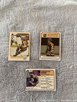 Three O-Pee-Chee 1981-82 Wayne Gretzky hockey cards showing front sides with player images and stats.