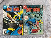 Front covers of two Batman comic books #343 and #349 laying side by side.