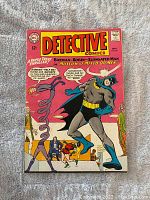 Front cover of Detective Comics #331 showing Batman and a twisting figure, with bright colors and vintage comic styling.