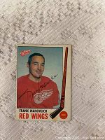 Front of signed Frank Mahovlich hockey card with color photo and autograph.