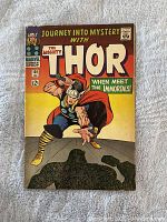 Front cover of Journey Into Mystery with The Mighty Thor issue #125 featuring Thor in a dynamic pose with his hammer amid a colorful background.