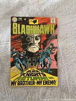 Front cover of Blackhawk comic book issue 242 with colorful illustration and title.