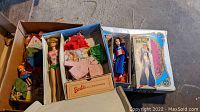 Overall contents: double doll case, three boxed dolls, assorted outfits and accessories