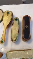 Vintage French DuBarry Shelltone Pyralin vanity brushes with green accents and natural bristles