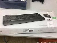 Box showing Microsoft Wireless 2000 Desktop keyboard with image of keyboard on top and product details around.