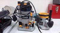 Rona Magestic plunge router showing power cord, handles, and plunge depth adjustment features.