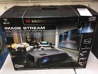 Front of Monster Vision Image Stream box showing product render and key specs (Wi-Fi, 1080P FHD, 6000 lumens, includes screen, stand, travel case)