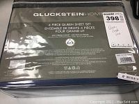 Front packaging of the sheet set showing brand, size, and main features.