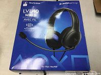 Front of box showing PDP Gaming LVL40 wired stereo gaming headset for PS4 with image and branding.