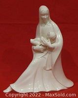 White ceramic figurine of Mary holding Baby Jesus in a seated pose, Baby Jesus removable