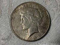 Obverse side of the 1923 Silver Peace Dollar coin showing Liberty profile and details of inscriptions and date.