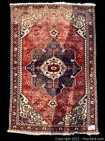 Full overhead view of entire rug laid flat against black background