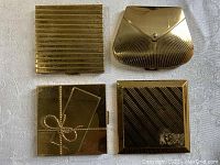 All four vintage Volupte compacts arranged in a square showing their top designs.