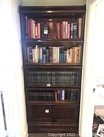 Full assembled Globe-Wernicke barrister bookcase loaded with books