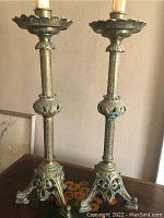 Front view of both candlesticks side by side on table