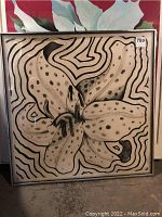 Full front view of framed black-and-white abstract flower print