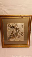 Framed Asian metal art depicting ducks on tree branch with gold, silver, and copper details.
