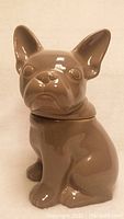 Front and side angle view of the grey French bulldog ceramic container showing details.
