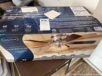 Original boxed Harbor Breeze Centreville 42-inch ceiling fan in unopened sealed packaging.