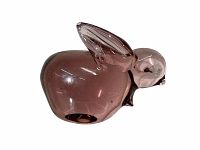 Side view of purple art glass rabbit showing clear body color and shape details.