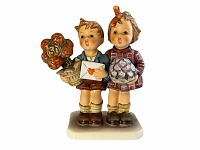 Front view of Hummel figurine Jubilee #416 showing two children, detailed painting and measuring 6 inches tall.