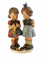 Front side view of Hummel figurine showing two girls, one knitting with ball of yarn on the ground.