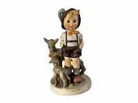 Front view showing the boy with goats on a round base, nice detail of colors and hand-painting.
