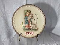1990 Hummel plate with child holding lamb and goat