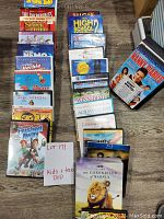 Full view of DVDs laid out, showcasing multiple kids and teen movie titles in original cases.
