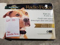 Photo of damaged box showing Petsafe Radio Fence product with large dog image and product branding