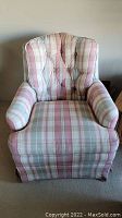 Front view of the upholstered Sherrill armchair showing overall plaid fabric pattern and seat cushion