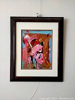 Full frontal view of framed abstract painting hung on wall