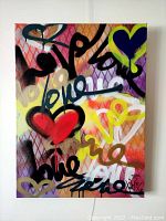 Front view of multicolour street art canvas showing hearts and 'love' graffiti