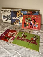 Photo showing the collection: German 88mm Gun Flak 36/37 model kit box, Scrabble Junior board game box, Donkey Party pin the tail on the donkey box, and four Walt Disney home movie color title cards.