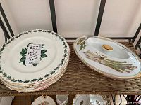 Stack of six Royal Albert Lady Clare dinner plates alongside Evesham covered vegetable dish with botanical design and gold trim