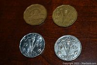 Four Canadian nickels from 1942, 1943, 1944, and 1945 showing front and back sides with torch emblem and beaver.