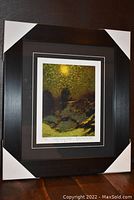 Full view of the framed and matted fine art print "Early Evening Winter" showing the artwork and frame with protective corner covers.