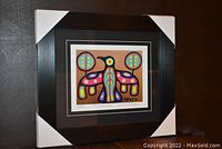Framed fine art print "Thunderbird Spirit" by Christian Morrisseau with protective cardboard corner guards on frame edges.