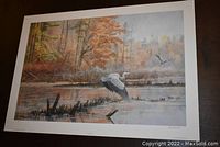 Unframed fine art print depicting a marsh scene with a white bird in flight and autumn foliage.