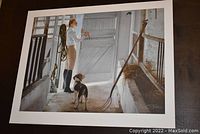 Full view of the unframed fine art print showing a man and young beagle inside a barn with farming tools and open barn door.