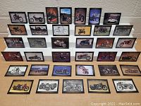 Front view of three display boards each holding multiple framed Harley Davidson collector cards, showing various motorcycles.
