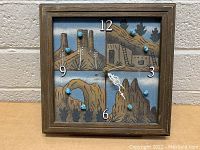 Front view of wooden framed square clock with Native American sand painting and turquoise stone hour markers
