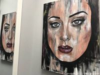 Front view of the mixed media portrait showing detailed brush work on woman's face and canvas edges.