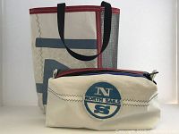 Front view showing both large tote and smaller zipper pouch with visible colors and designs.