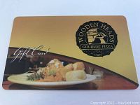 Plastic gift card with Wooden Heads Gourmet Pizza logo and plated food image.