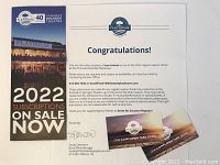 Photo of two complimentary ticket vouchers with accompanying letter from the playhouse box office manager and a promotional brochure for 2022 subscriptions.