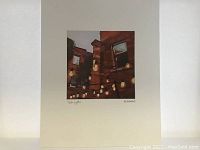 Print and matte showing 'Patio Lights' by Michelle Reid with cityscape and glowing patio lights.
