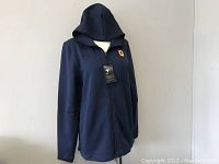 Front view of navy blue Nike Dri-Fit zip front hoodie with Queen's 'Q' logo and Nike Swoosh on chest, displayed on mannequin.